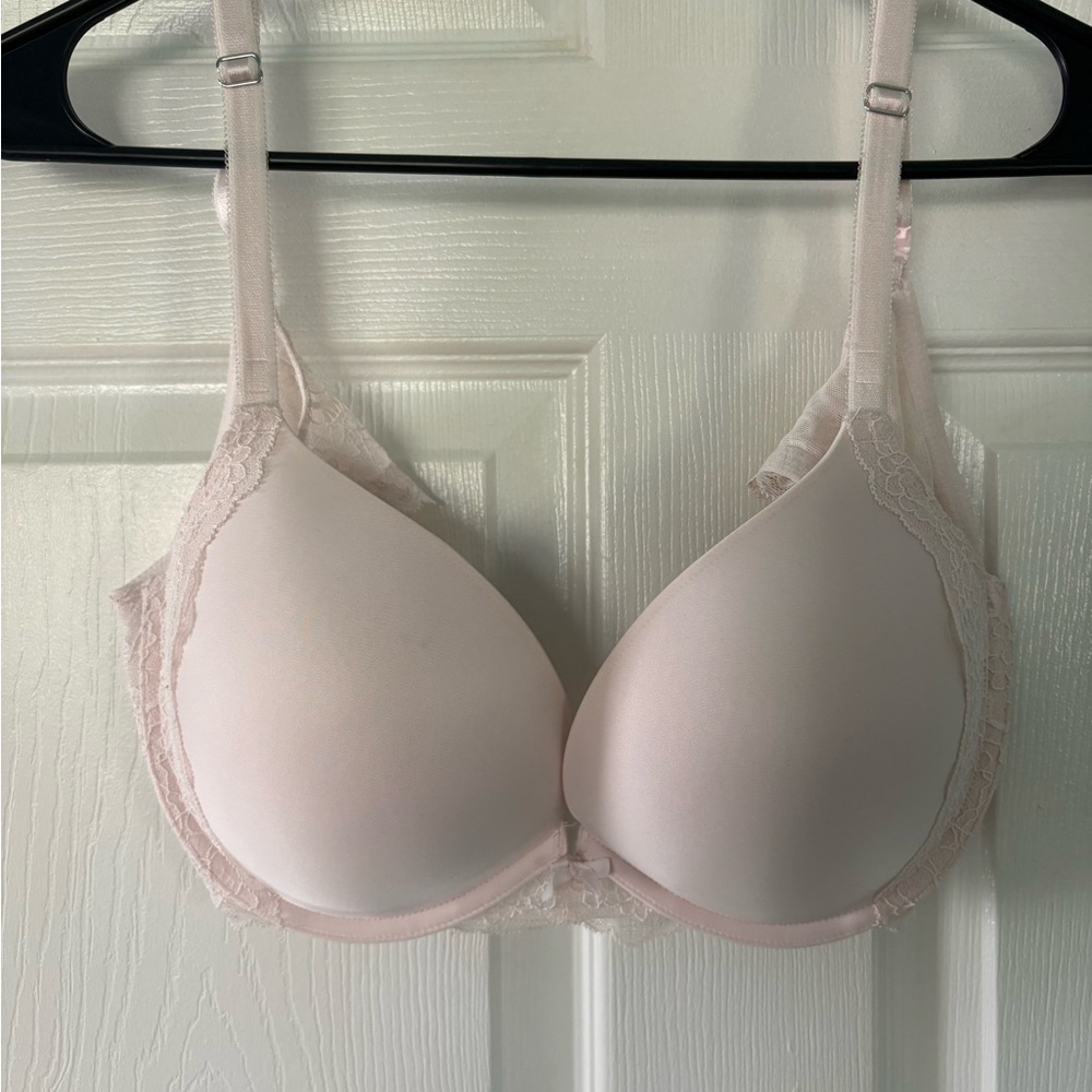 Victorias Secret Elegant Lace Trimmed Bra in light cream color padded